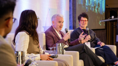 A photo of a panel at AICON that was moderated by the author, Natasha Clarke