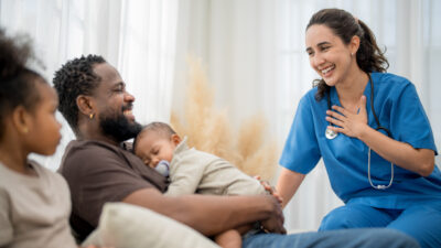 A physician and a family in a community-based care setting.